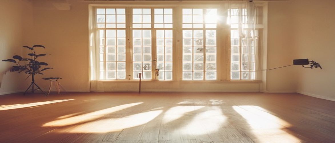 Athlete performing a dynamic bodyweight movement in a bright studio space